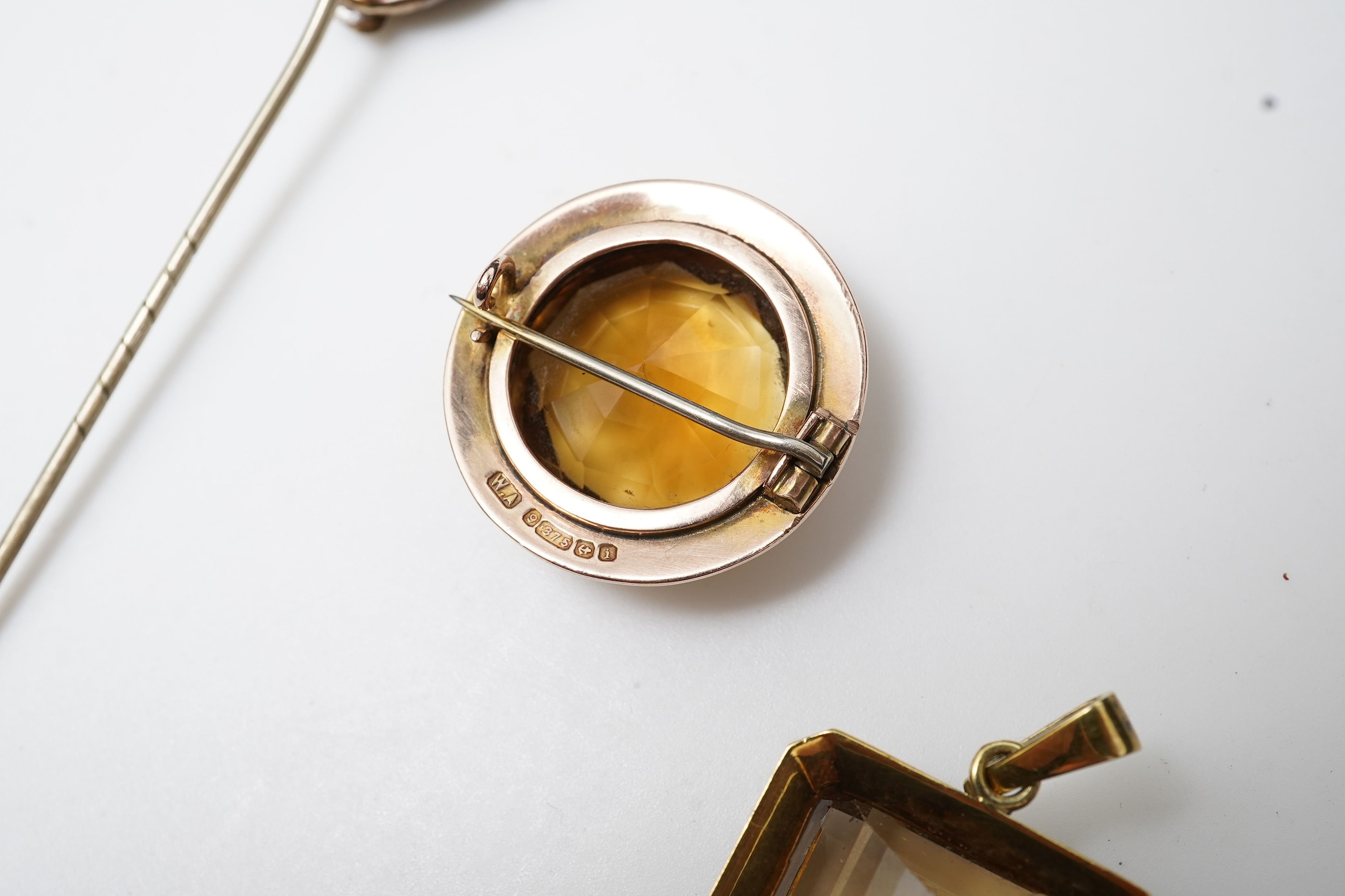 A citrine brooch and pendant, and onyx stickpin